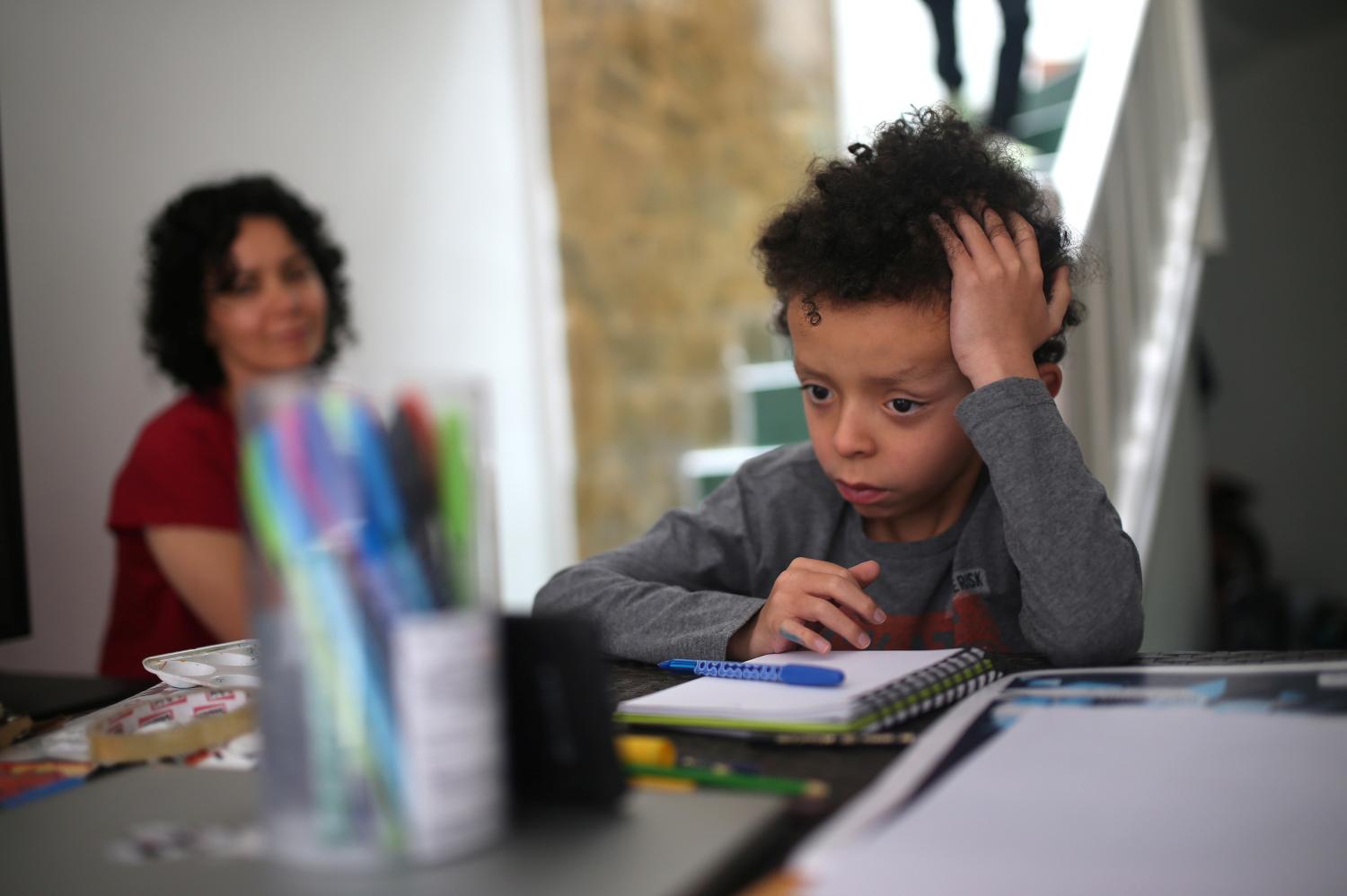 Martin Vernaza, 8, studies at home after school closes during the mandatory isolation decreed by the Colombian government as a preventive measure against the spread of the coronavirus disease (COVID-19), in Bogota, Colombia April 2, 2020. REUTERS/Luisa Gonzalez