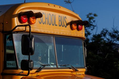 A school bus driver navigates while driving through downtown Los Angeles, California, U.S. July 19, 2023. Credit: REUTERS/Mike Blake/File Photo