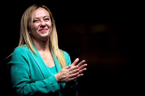 Giorgia Meloni, leader of Italian far-right party Fratelli d Italia Brothers of Italy, applauds during a rally as part of the campaign for general elections.