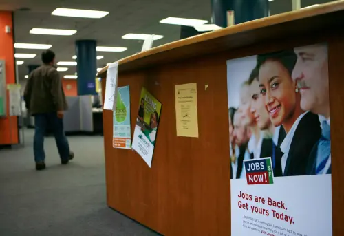 A person enters at a jobs center in San Francisco, California, on February 4, 2010. The number of workers filing for jobless benefits unexpectedly rose last week, but another big gain in productivity in the fourth quarter offered hope companies were getting close to adding to payrolls.