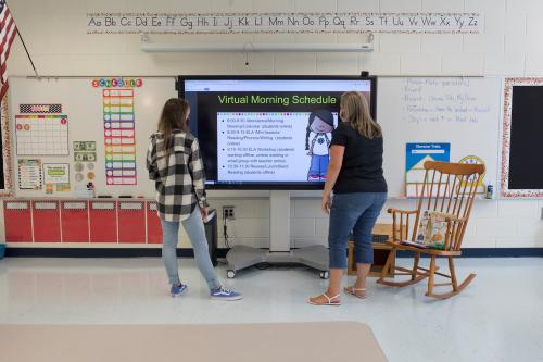 Teachers finalize their virtual open house presentation in advance of the start of the online school year on July 29, 2020.